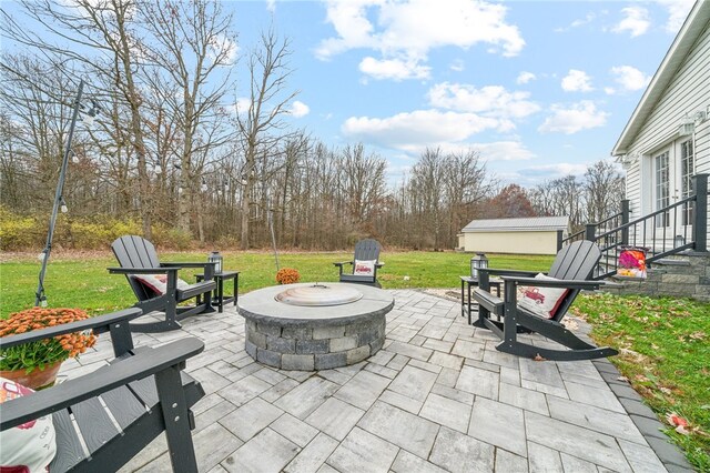 view of patio / terrace with an outdoor fire pit