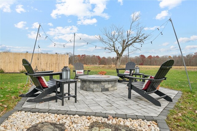 view of patio with a fire pit