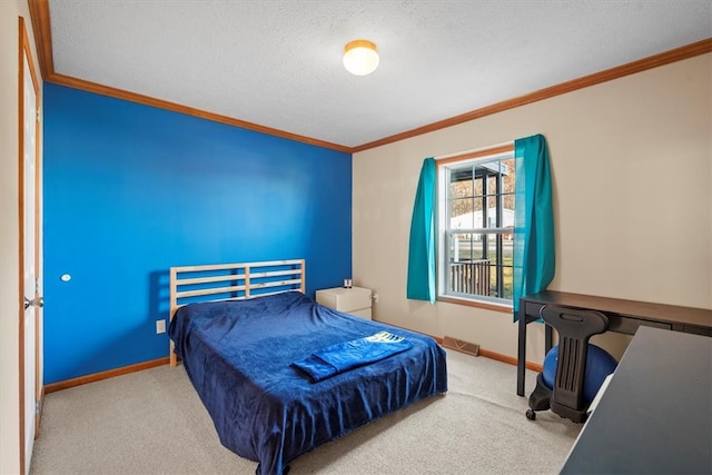 bedroom featuring a textured ceiling, ornamental molding, and light carpet