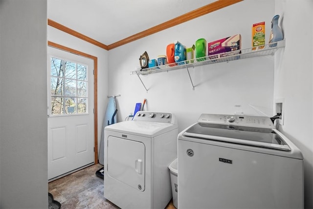 clothes washing area with independent washer and dryer and ornamental molding