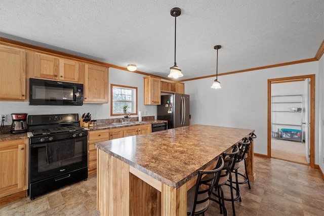 kitchen featuring hanging light fixtures, black appliances, a textured ceiling, sink, and a kitchen island