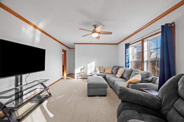 living room with ceiling fan, crown molding, and carpet