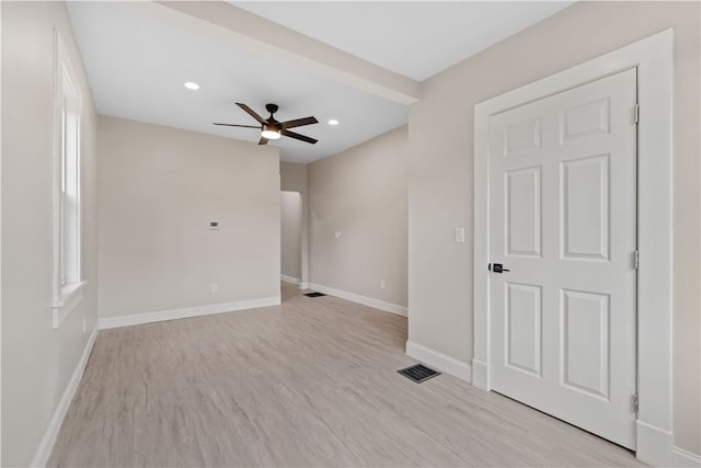 empty room featuring light hardwood / wood-style floors and ceiling fan