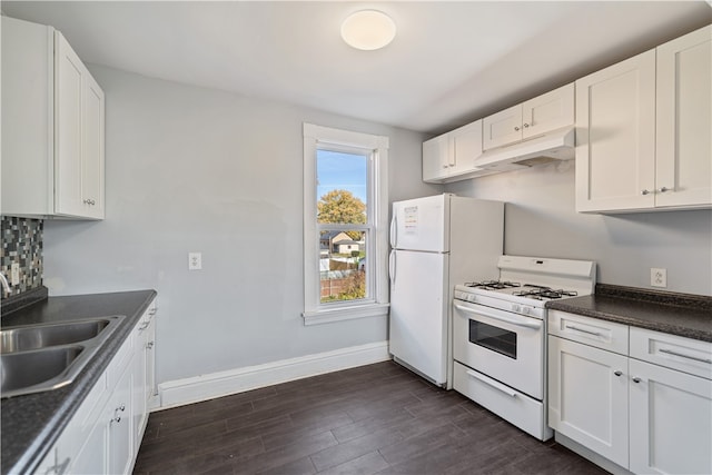 kitchen featuring white cabinetry, white appliances, and sink