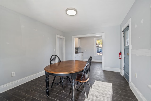 dining room with dark hardwood / wood-style floors