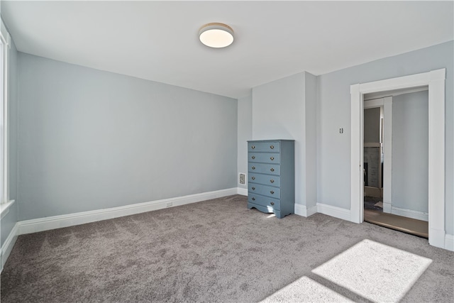 unfurnished bedroom featuring carpet