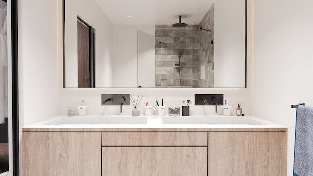 bathroom with vanity and tiled shower