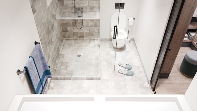 bathroom with a tile shower