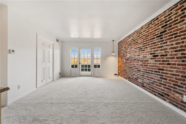 1000 Margarite Dr Unit G, Scott Twp Sal, PA 15216 - unfurnished living room featuring carpet flooring, brick wall, and baseboards
