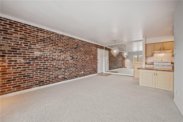 1000 Margarite Dr Unit G, Scott Twp Sal, PA 15216 - unfurnished living room featuring brick wall, a chandelier, and carpet