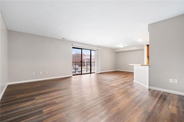 empty room featuring wood-type flooring