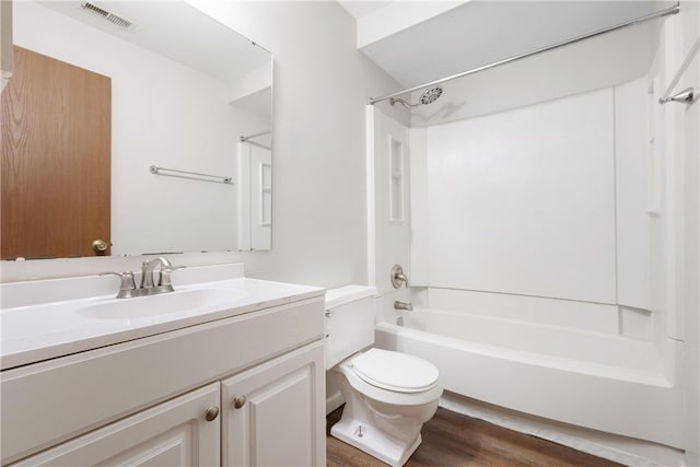 full bathroom featuring toilet, shower / tub combination, vanity, and wood-type flooring