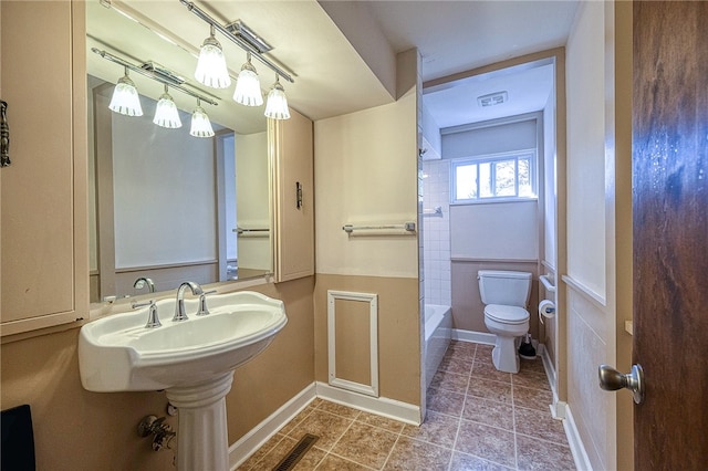 bathroom with tile patterned floors and toilet