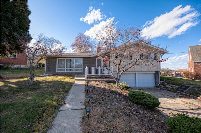 view of front of house with a garage and a front lawn