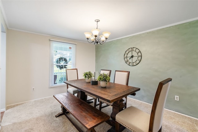 carpeted dining area with a notable chandelier and ornamental molding