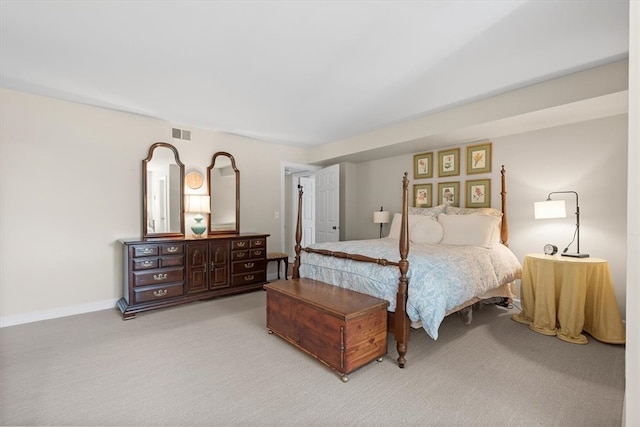 bedroom featuring light colored carpet