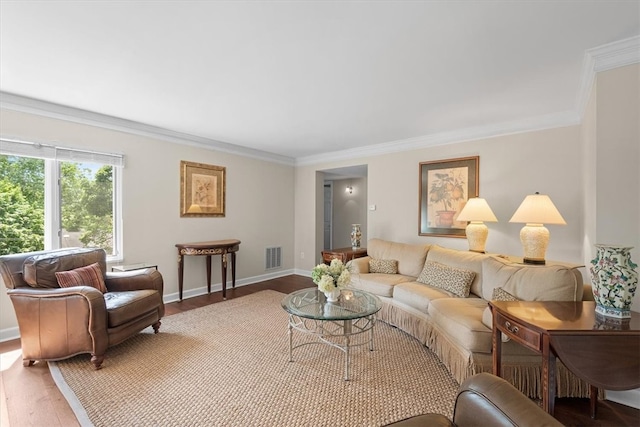 living room with hardwood / wood-style flooring and crown molding