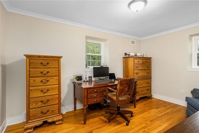 office space with ornamental molding and light wood-type flooring