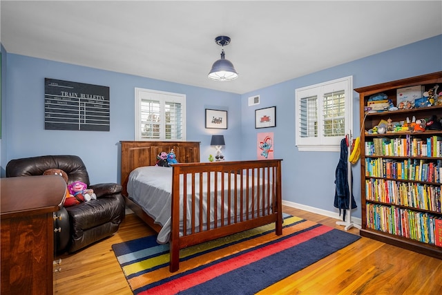 bedroom featuring light hardwood / wood-style floors