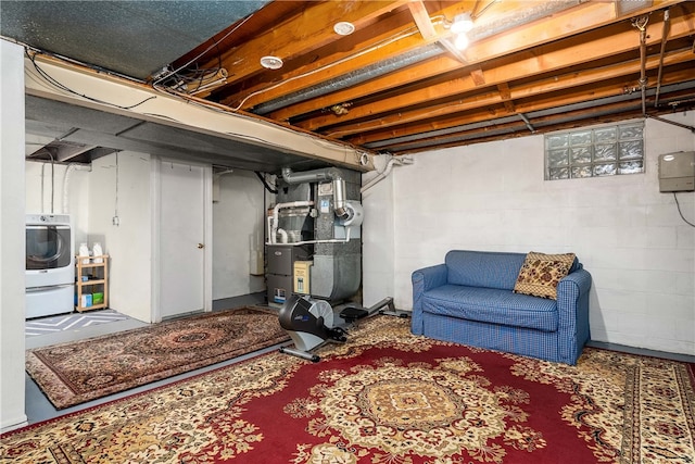 basement with washer / dryer and heating unit