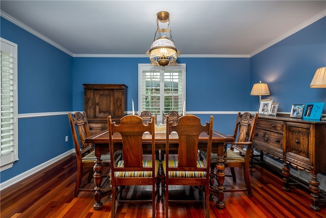 dining space with a wealth of natural light, dark hardwood / wood-style floors, crown molding, and a notable chandelier