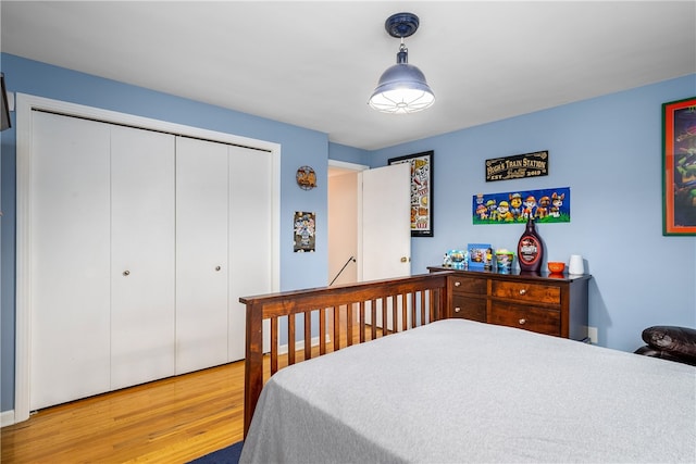 bedroom featuring hardwood / wood-style flooring and a closet