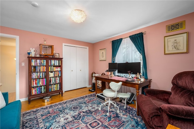 home office featuring hardwood / wood-style flooring