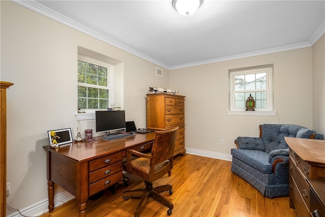 home office featuring light wood-type flooring and crown molding