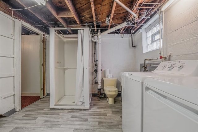 interior space with washer and dryer and light hardwood / wood-style floors