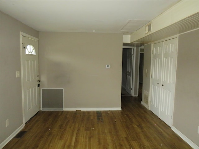 entryway with dark wood-type flooring