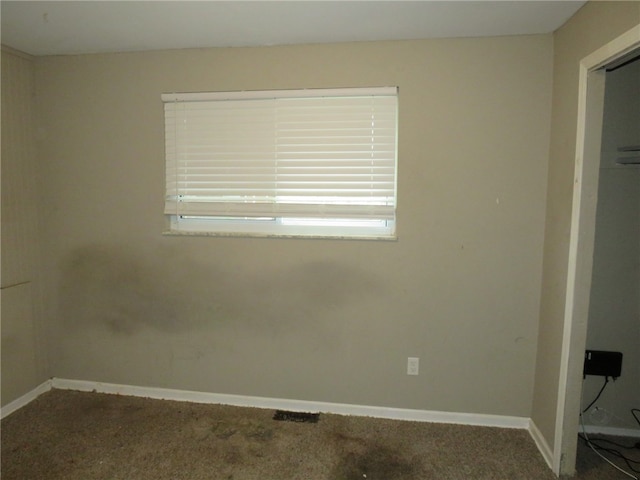 empty room with carpet flooring