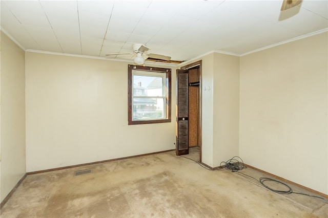 spare room with ceiling fan, carpet floors, and ornamental molding