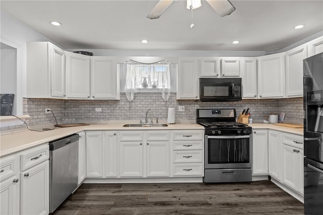 kitchen featuring white cabinetry, appliances with stainless steel finishes, and sink