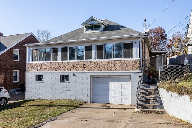 view of front of property with a garage