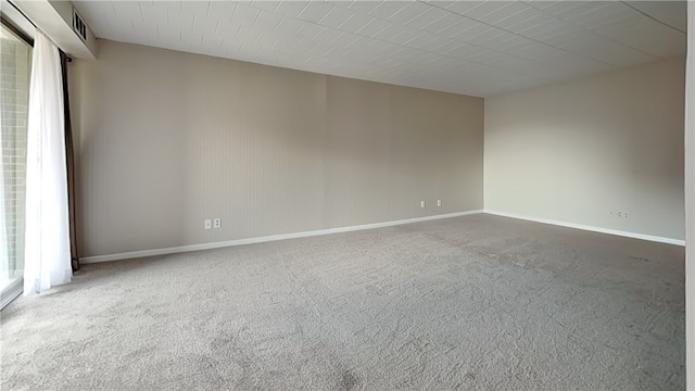 empty room with carpet flooring