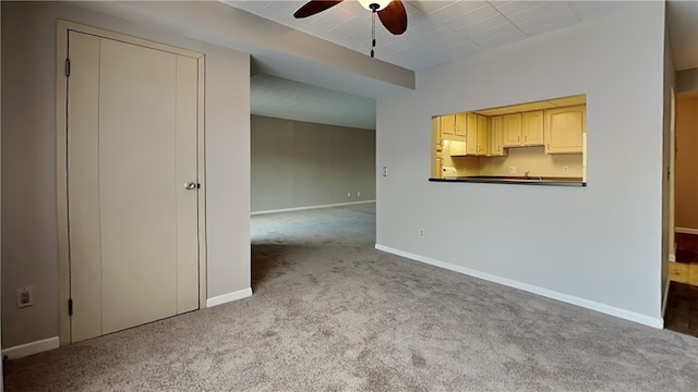 spare room with light carpet and ceiling fan