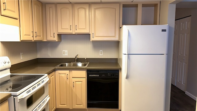 kitchen with light brown cabinets, sink, white appliances, and dark hardwood / wood-style floors