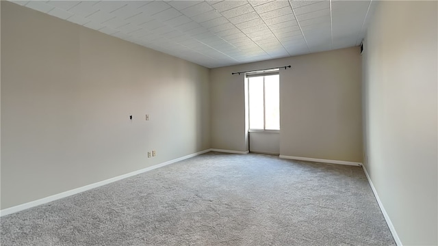 unfurnished room with carpet