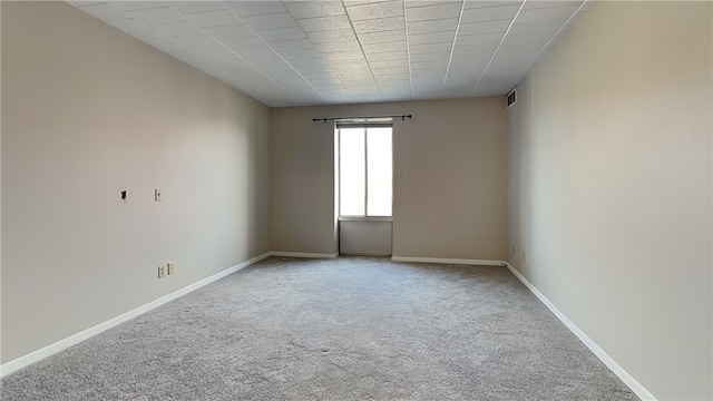 unfurnished room featuring carpet