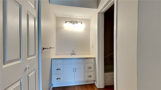 bathroom featuring vanity and hardwood / wood-style flooring