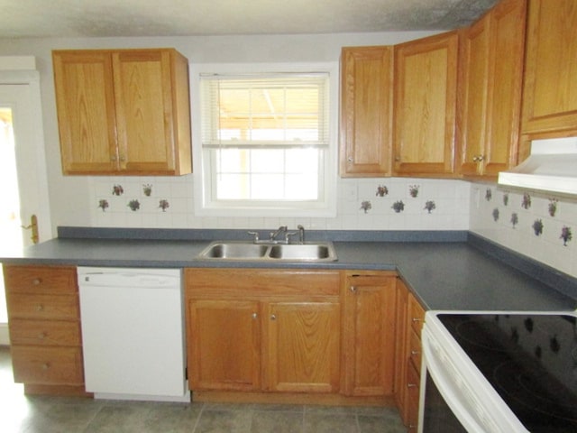 kitchen featuring tile patterned floors, range hood, decorative backsplash, sink, and white appliances