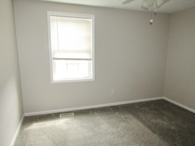 205 Wheatfield Dr, Hempfield Twp Wml, PA 15601 - carpeted spare room with baseboards and a ceiling fan
