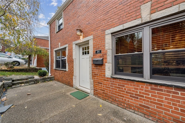 doorway to property with a patio area