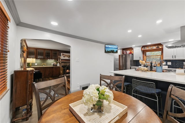 dining area featuring ornamental molding