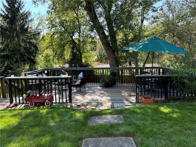 wooden terrace with a yard