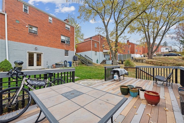 wooden terrace with a yard