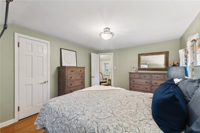 bedroom with light hardwood / wood-style floors