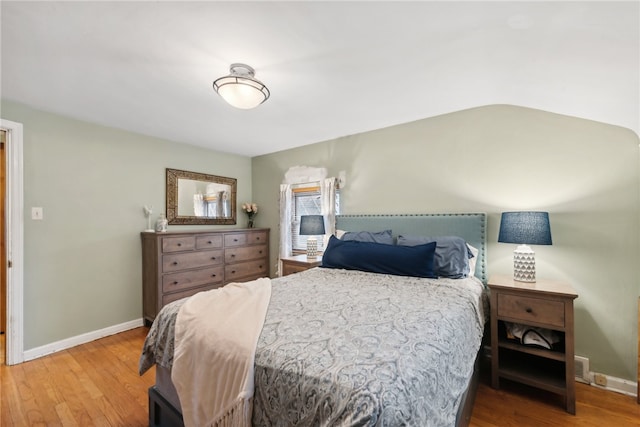 bedroom with hardwood / wood-style floors