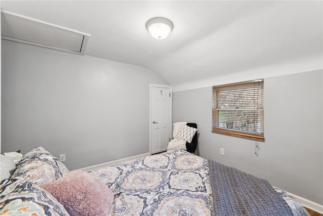 bedroom with vaulted ceiling