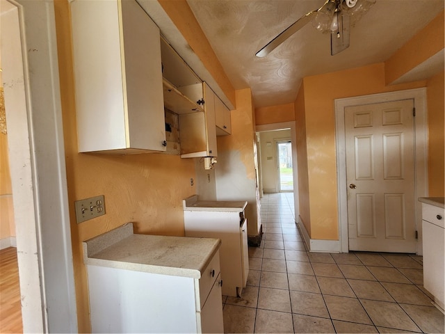 kitchen featuring light tile patterned flooring and ceiling fan